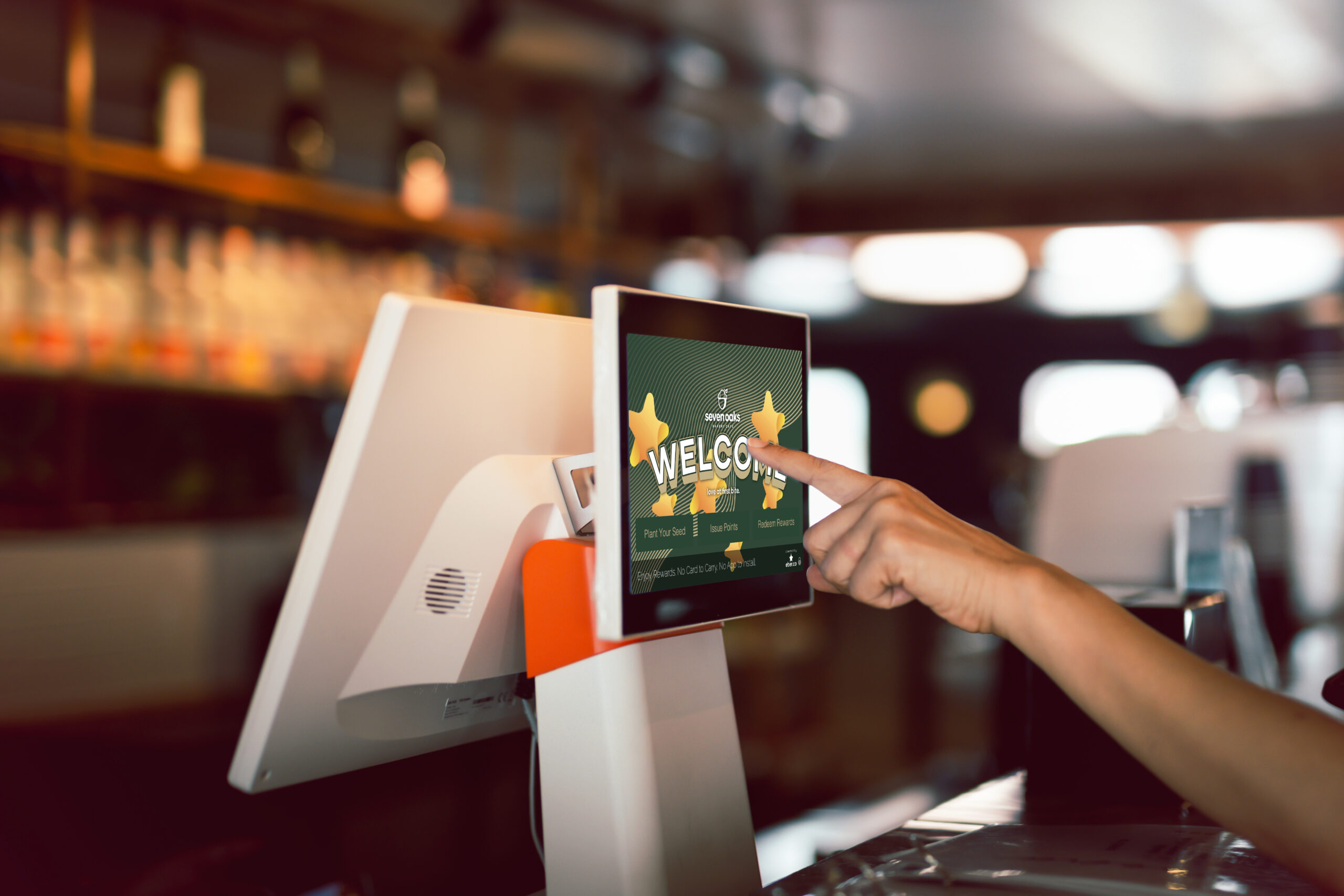 woman hand doing process payment on a touchscreen cash register.